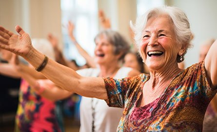 Senior with hands up